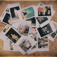 Scattered instant photos on the floor.