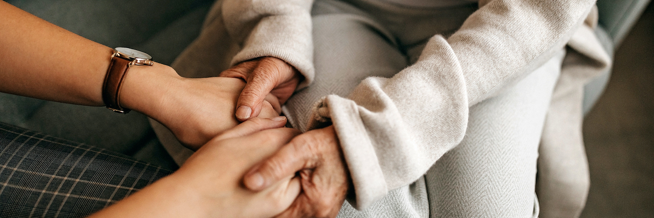 A Day in the Life Living With Fibromyalgia While Caregiving Senior holding hands with adult