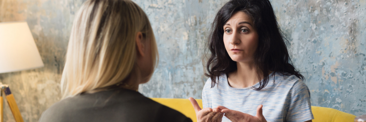 Examples of Hard Conversations About Health From Real People photo of two women talking and having a serious conversation