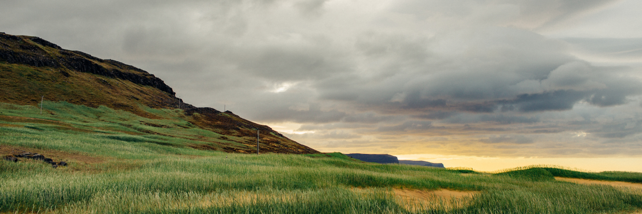 What Emerging From a Chronic Illness Flare-Up Feels Like Sand dunes in the Westfjords, Iceland on an overcast evening.
