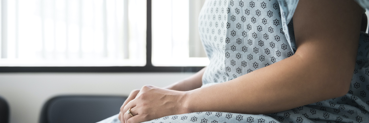 How Sharing Genetic Testing Information Could Have Saved My Wife Midsection of female patient wearing a hospital gown