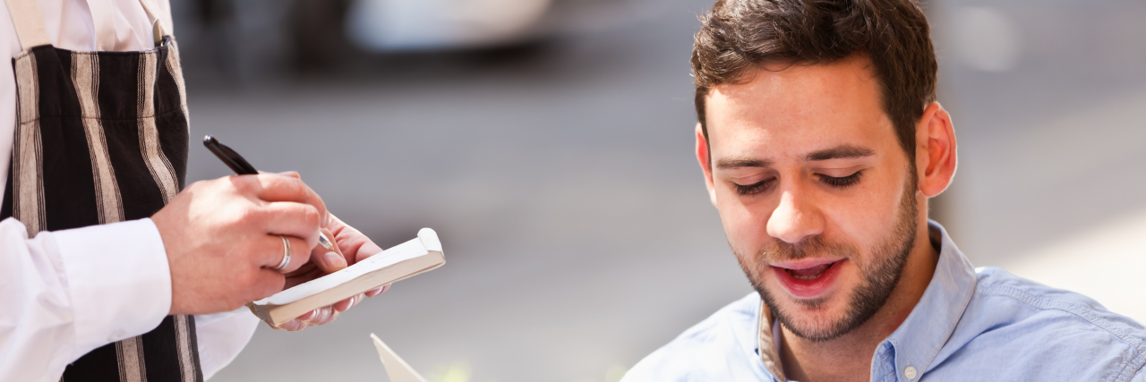 What I Want to Say vs. What I Can Say as a Person Who Stutters Man ordering from a restaurant menu.