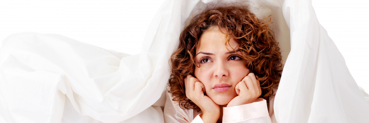 Disabled and Chronically Ill People: It's OK to Complain Sometimes Sad woman in bed.