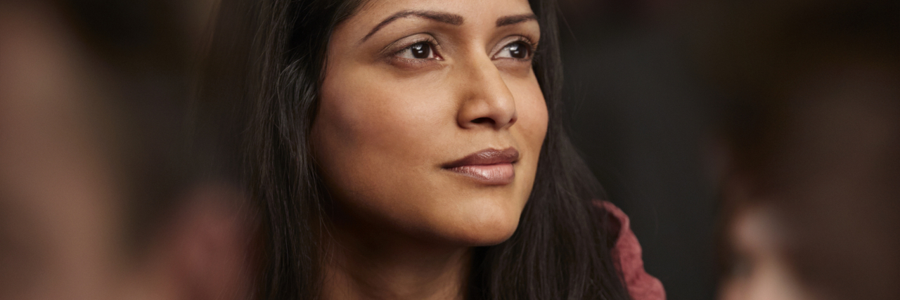 The Hyperfocus Day, Low Motivation Day, and Other Ways ADHD Impacts Me photo of a woman looking off into the distance