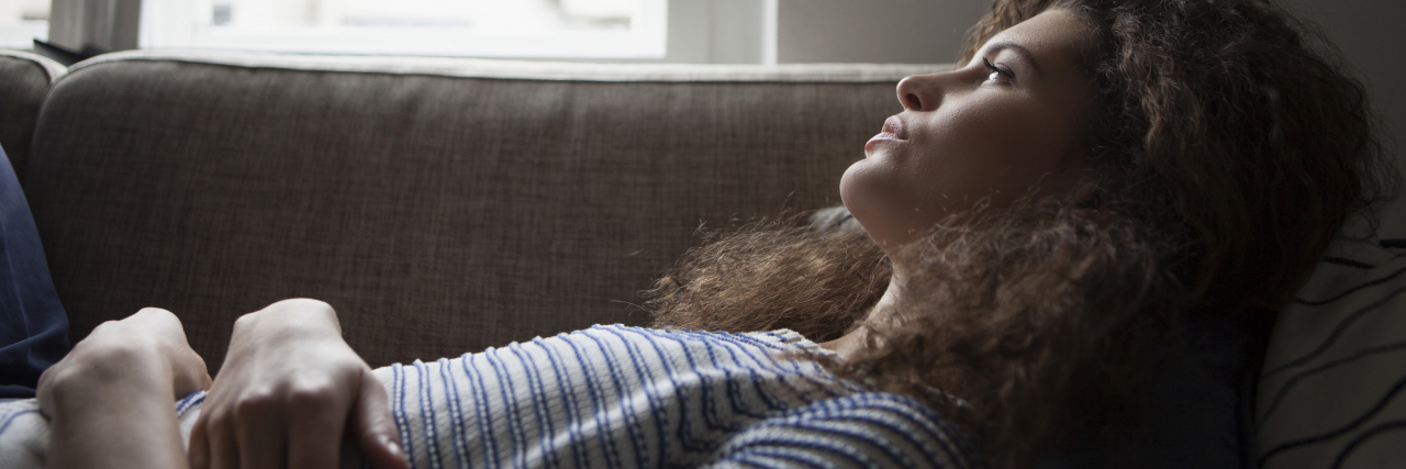 Politicians: Stop Using Sexual Abuse Terms to Rile Your Base serious looking woman lying on sofa looking out of window