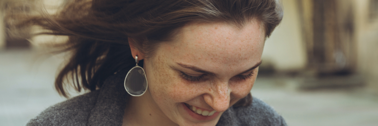 Thank You to Chipotle Staff Member Who Helped Quiet My Eating Disorder Woman with dark hair smiling and looking downwards