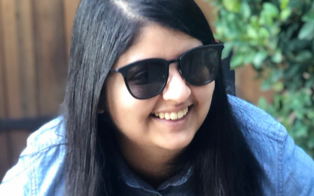 photo of contributor Ameera Ladak wearing sunglasses and smiling