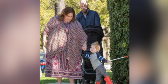 Jack Junior holding a cane with this parents, Kate and Toby, from "This Is Us"