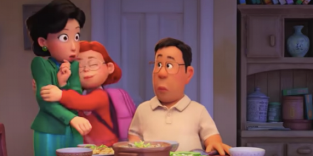 Mei from "Turning Red" film hugging her mother at dinner, while her father looks on