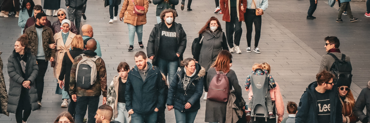 photo taken in London, showing the majority of people not wearing COVID-19 face coverings and only a few people in masks