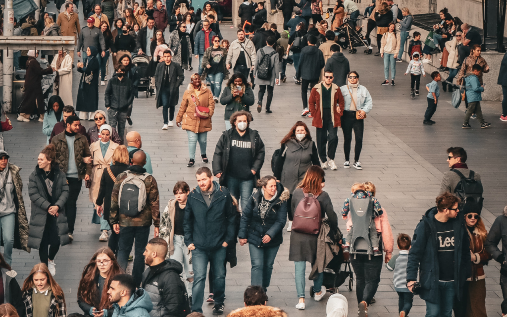 photo taken in London, showing the majority of people not wearing COVID-19 face coverings and only a few people in masks