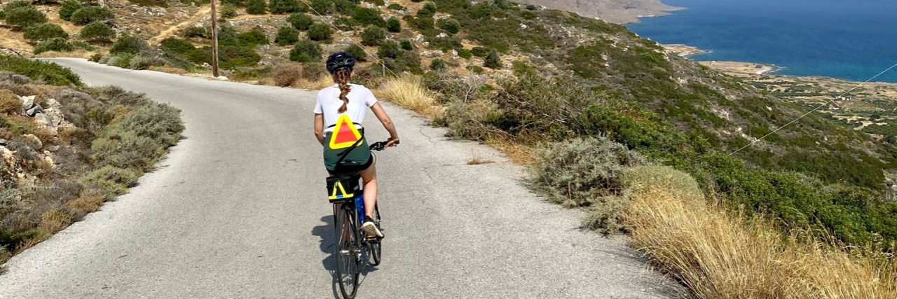Finding a Healthy Balance With Exercise in Eating Disorder Recovery Contributor riding bike on road near body of water