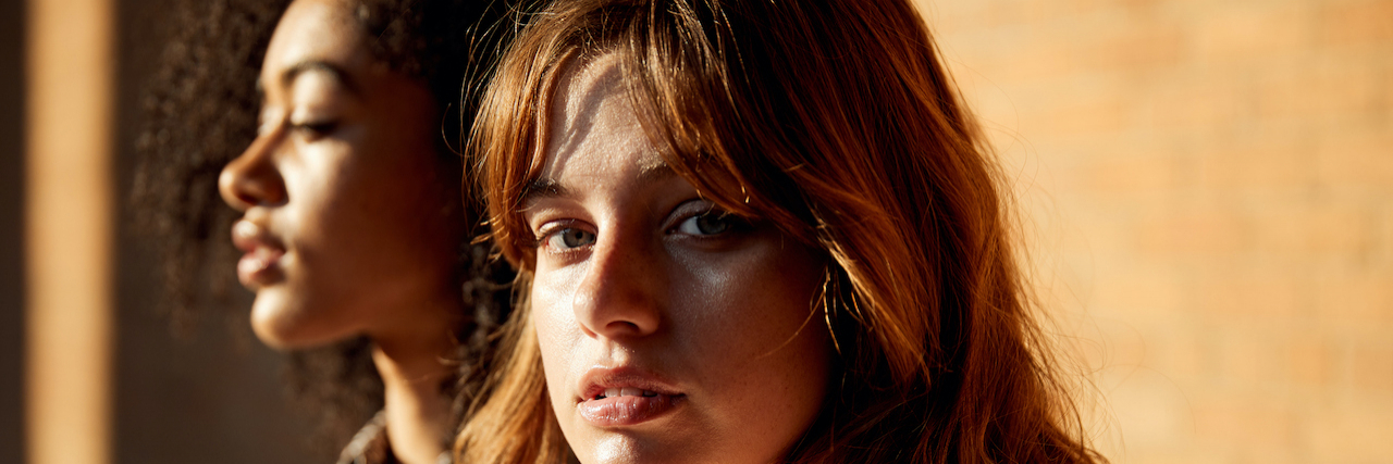 How the U.S. Health Care System Mistreats Women White woman looking at camera, next to Black woman