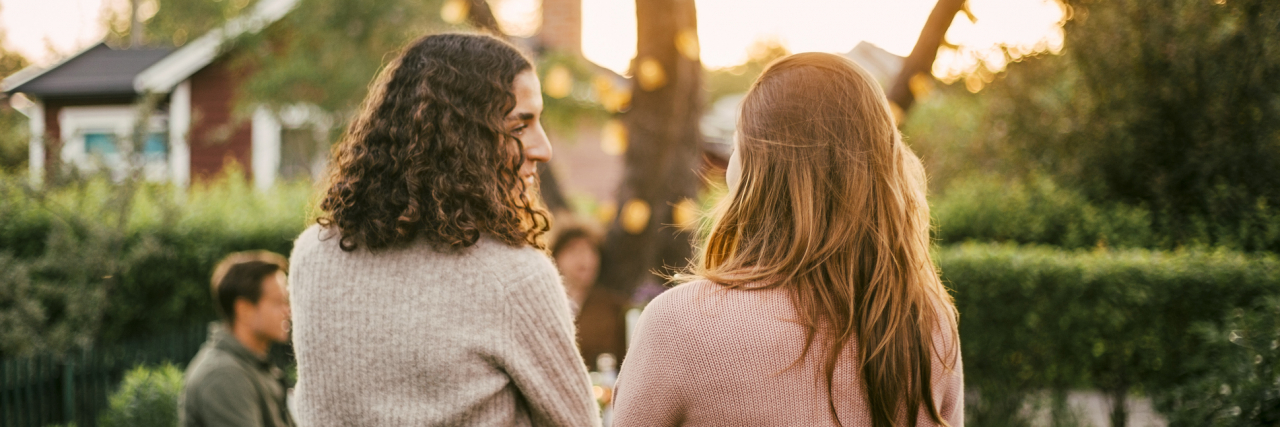 The Friendship That Made Me Say 'Thank You' to Cancer photo of two friends talking in a garden
