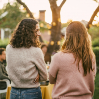 photo of two friends talking in a garden