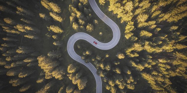 Why Identifying as Disabled Is a Complex and Personal Journey Car driving on winding mountain road. Overhead view..