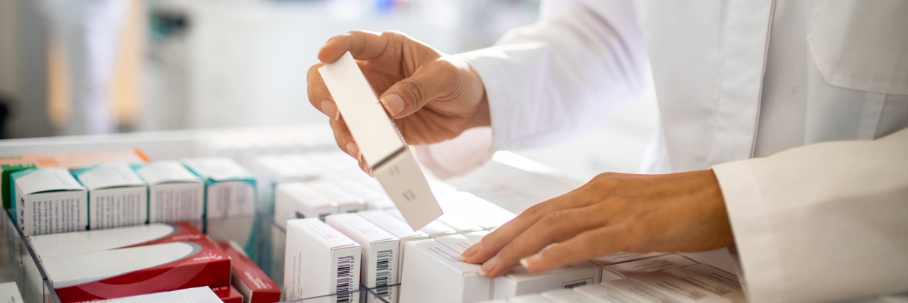 Pharmacist filling prescriptions.