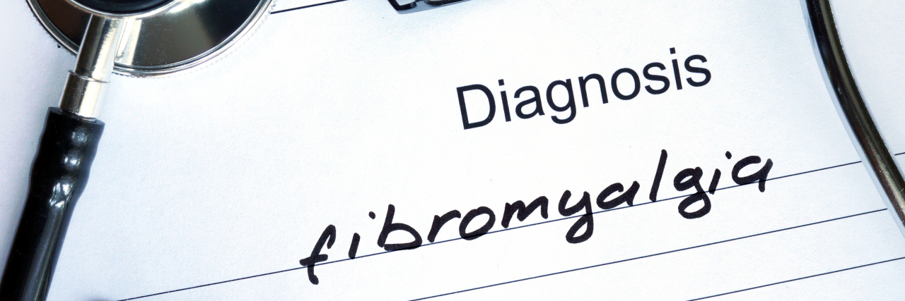 Diagnosis Fibromyalgia, pills and stethoscope.