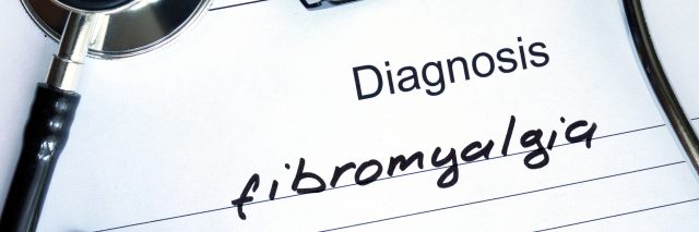 Diagnosis Fibromyalgia, pills and stethoscope.
