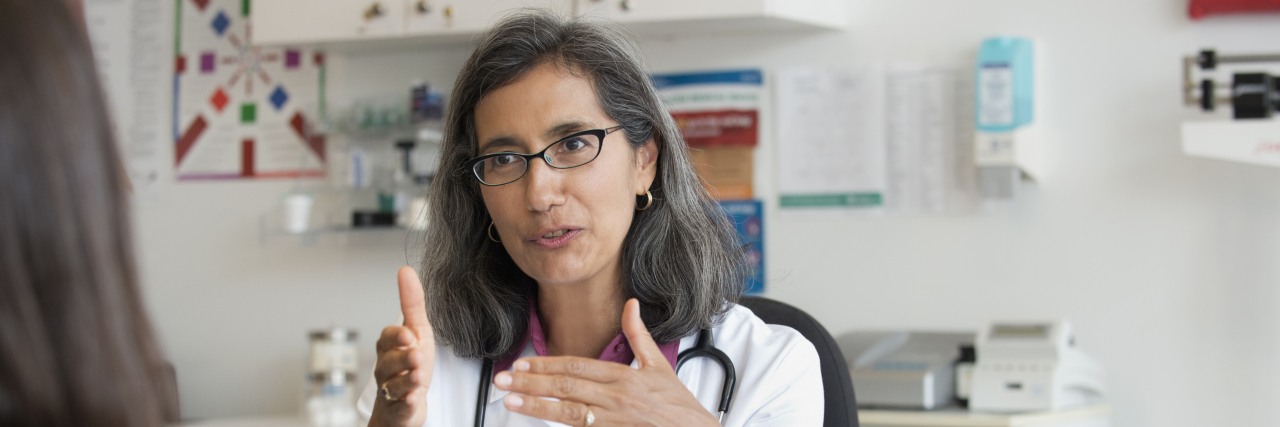 Finding a Supportive Doctor for Fibromyalgia Diagnosis and Treatment Doctor talking to patient.
