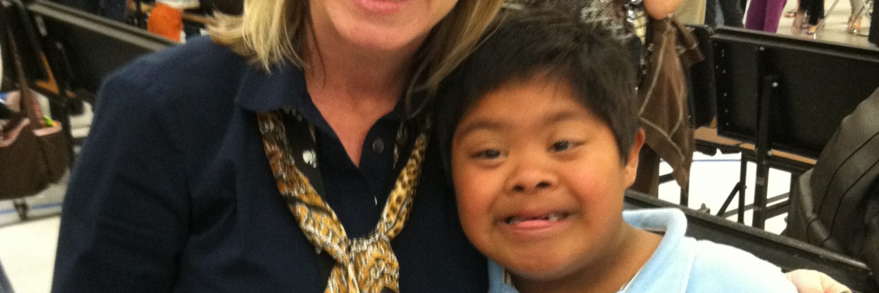Supporting Teachers Who Include Students With Disabilities Michelle's son who has Down syndrome with his teacher.