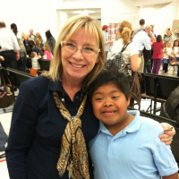 Michelle's son who has Down syndrome with his teacher.