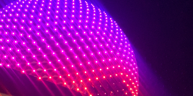 How Disney's New Park Reservation Systems Negatively Impact Neurodivergent Guests EPCOT's spaceship earth at night lit up with LEDs