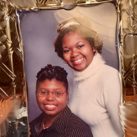 Framed photo of Jae and her sister.