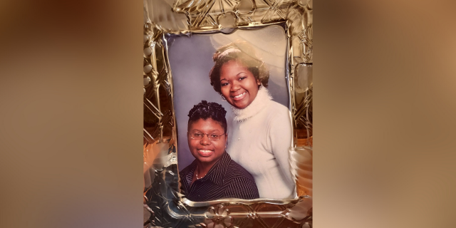 Framed photo of Jae and her sister.