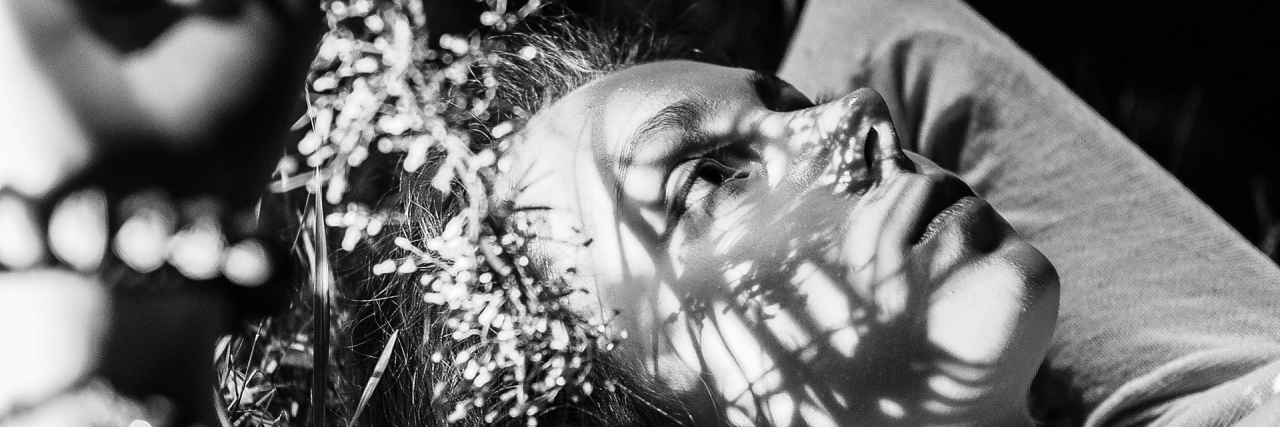 Grieving and Missing My Old Body After an Ulcerative Colitis Ostomy Woman on grass in black and white