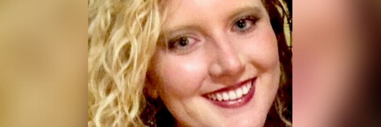 What Helps a Woman in Her Thirties With Bipolar II Disorder A woman with curly blonde hair and blue eyes smiles.