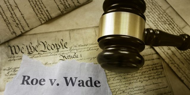 9 People With Health Conditions the Justices Who Overturned Roe v. Wade Didn't Stop to Consider Roe v Wade news headline with gavel on a copy of the United States Constitution.