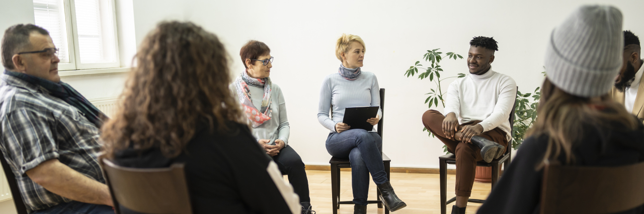 How Therapy and Support Groups Can Help People With Crohn's and IBD Group therapy support meeting for Crohn's disease and IBD.