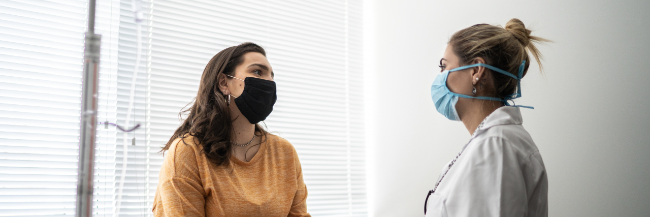 Patient Management and Consent in a Post-Roe Era Patient talking to doctor at medical appointment.