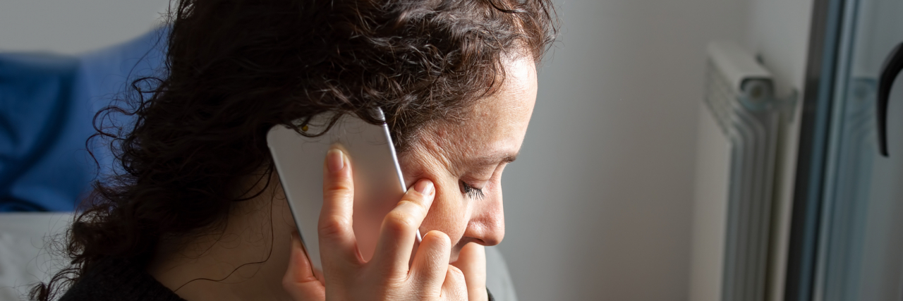 When You Get That Dreaded Phone Call From Your Doctor Woman on phone call with serious expression