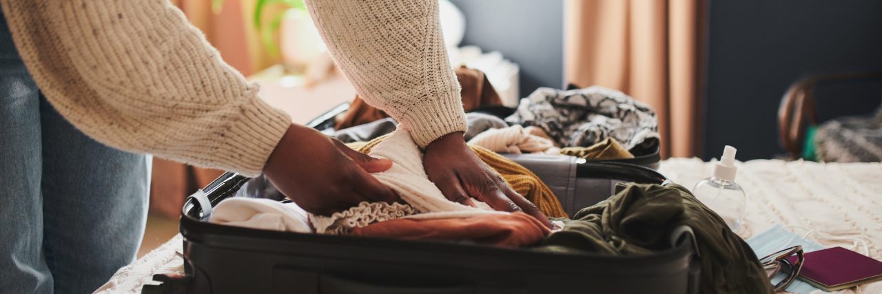 How to Pack for a Vacation With ADHD Cropped shot of an unrecognizable woman packing her things into a suitcase at home before traveling
