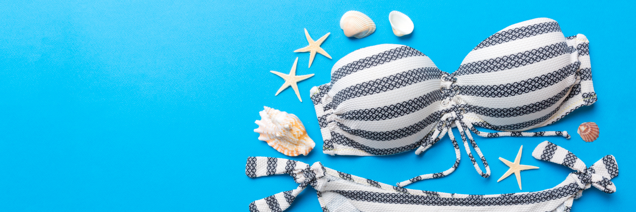 Learning to Love My Body in a Swimsuit as a Woman With Poland Syndrome Woman's swimsuit with stripes.
