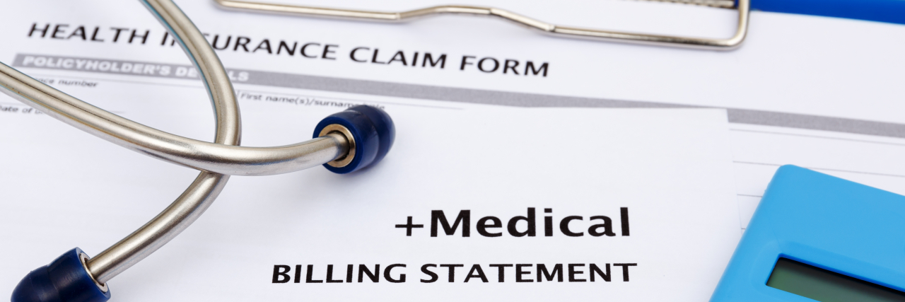 Medical Debt, Explained: What People With Chronic Illness Need to Know Healthcare cost concept with calculator and medical bills.