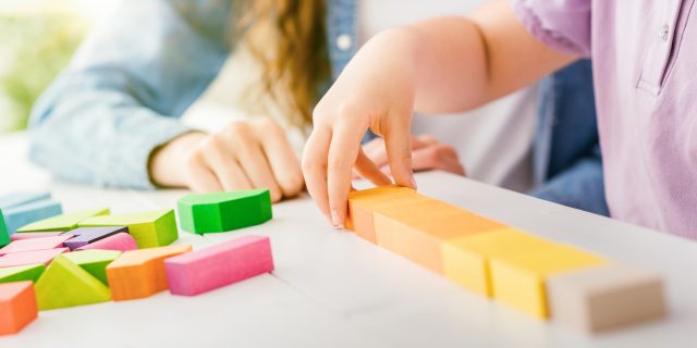 Child playing with wood blocks
