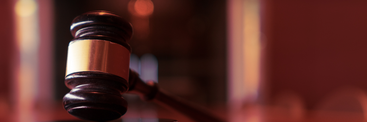 Why the Heard/Depp Verdict Puts Domestic Violence Survivors at Risk Judge's gavel on desk in courtroom.