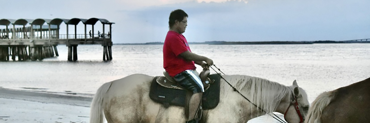 Yes, My Son With Down Syndrome Can Ride a Horse Raymond riding a horse