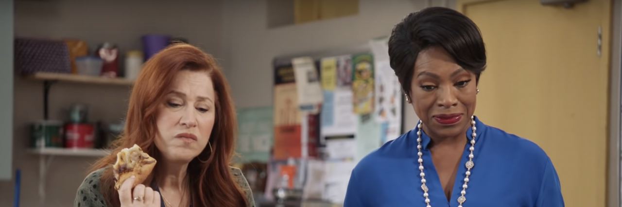 5 Easy Shows to Watch When You Need to Relax Two teachers from the show "Abbott Elementary" staring confusedly, both holding pizza.