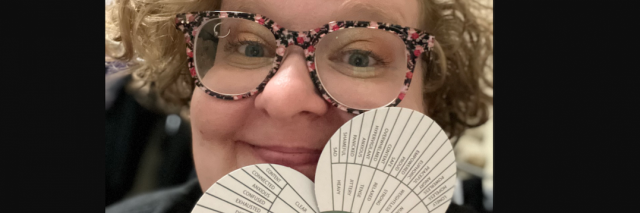 the author holding up The Body Sensations Wheel