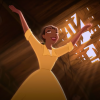 Tiana from Disney's "The Princess and the Frog." She has her arms raised towards the sky and is wearing her yellow waitress dress in the old sugar mill that she wants to make her restaurant.