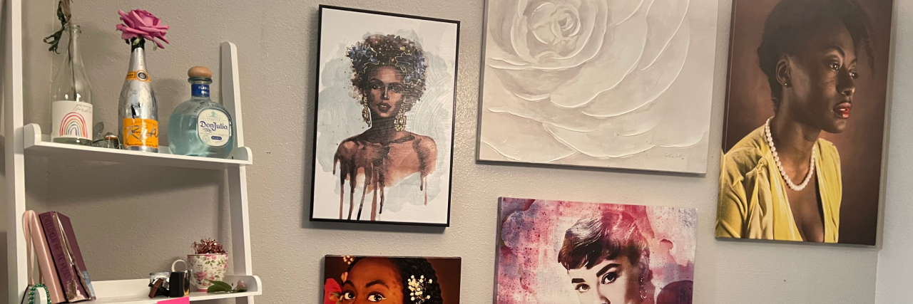 How to Utilize Color in Home Decor When You Have ADHD A room with a wall of a lot of art and a bookshelf with different bottles and books on them.