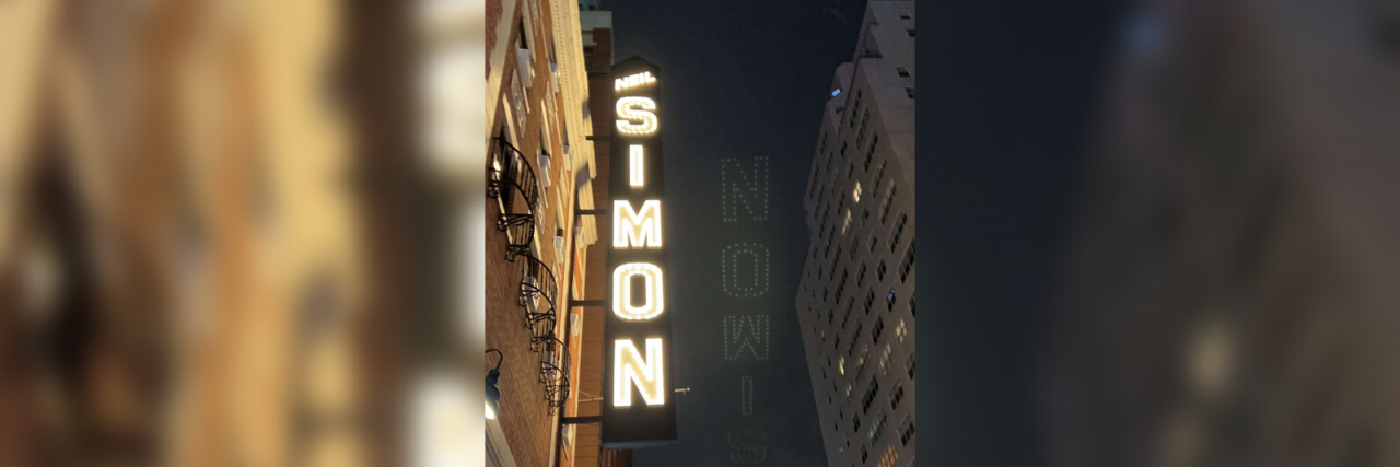 What Happened When a Woman Allowed People to Support Her for a Week Neil Simon theater at night in New York City with a blurred out version of the same photo behind it.