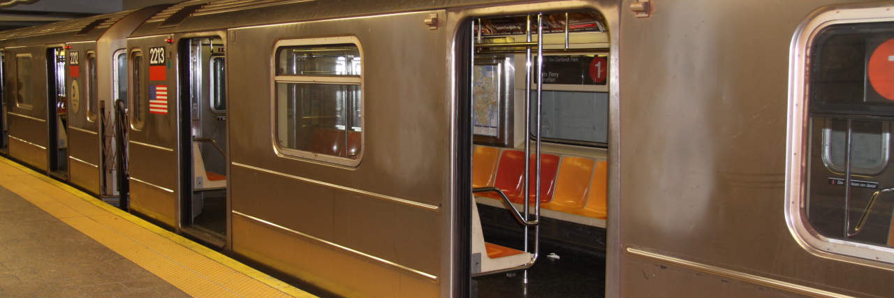 A subway train at a subway station.