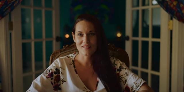 'The Deep End': Why Teal Swan's Cult of Personality Is Dangerous to Trauma Survivors Teal Swan sitting in a room, smiling at the camera, with doors open behind her.