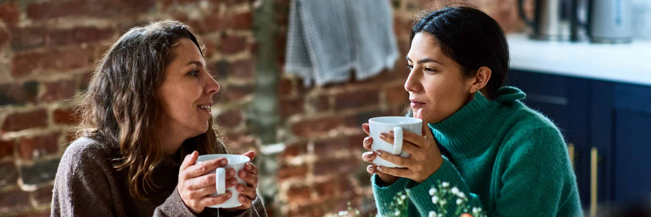 The 12 Best Pieces of Non-Medical Advice People With Lupus Have Received Two women enjoying hot drink having conversation