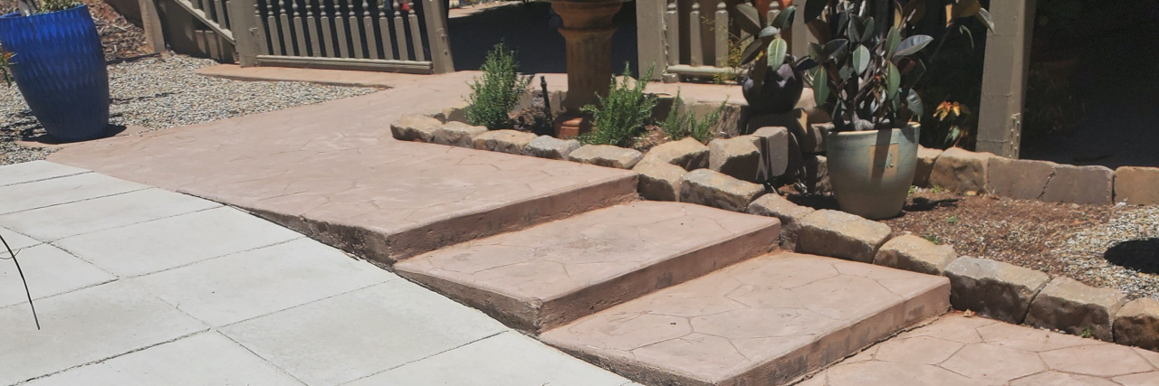 Tips for Moving Houses With Your Loved One With Traumatic Brain Injury A tiled walkway leading up to a house with shallow steps on one side.